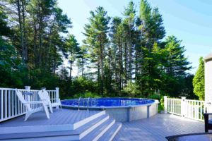 Mosquito Joe's services protect a beautiful patio and pool in a Connecticut backyard.